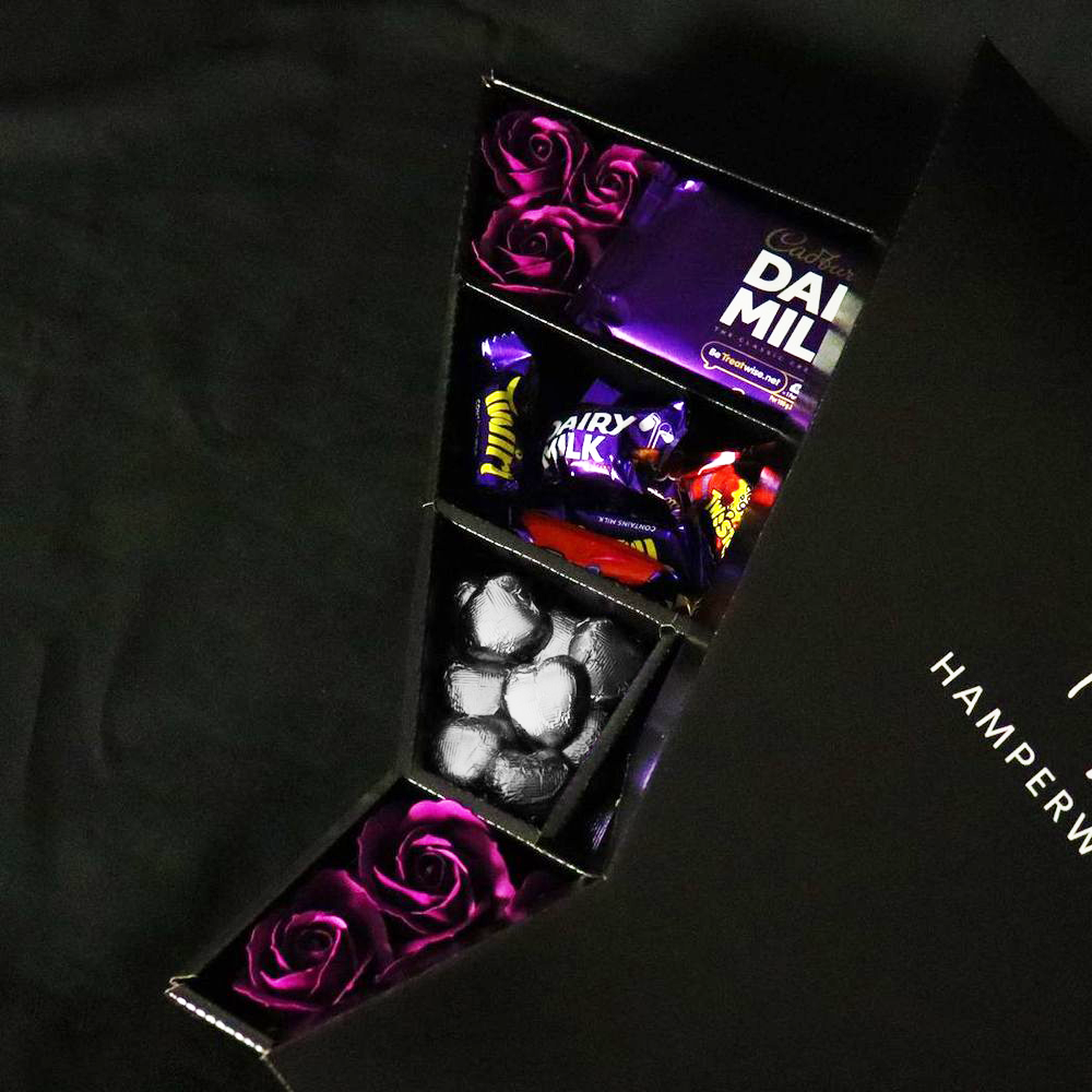 Chocolate Cadbury Heroes with Regal Purple Roses Bouquet