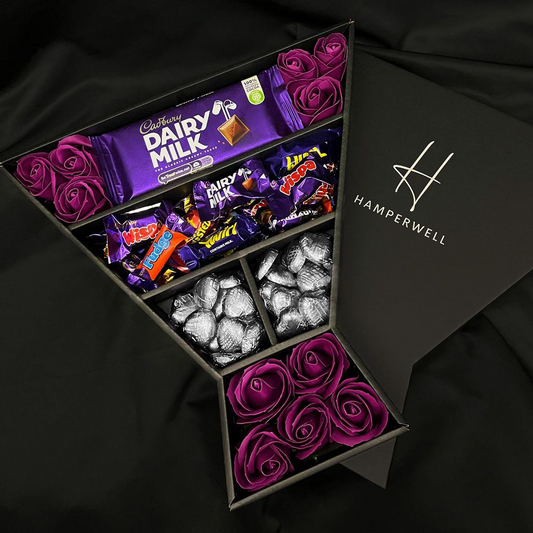 Chocolate Cadbury Heroes with Regal Purple Roses Bouquet